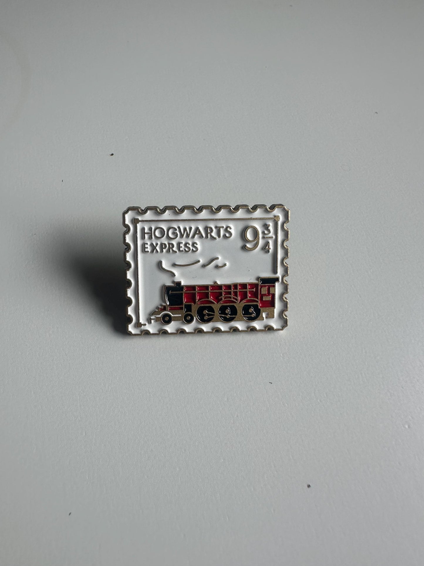 Wizarding pins - flying/winged key, train ticket, post stamp, grim teacup