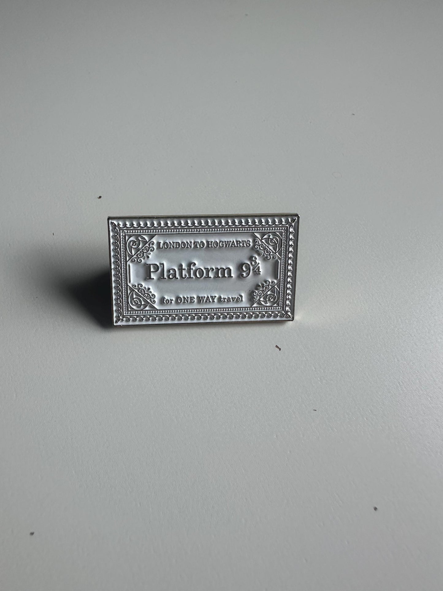 Wizarding pins - flying/winged key, train ticket, post stamp, grim teacup