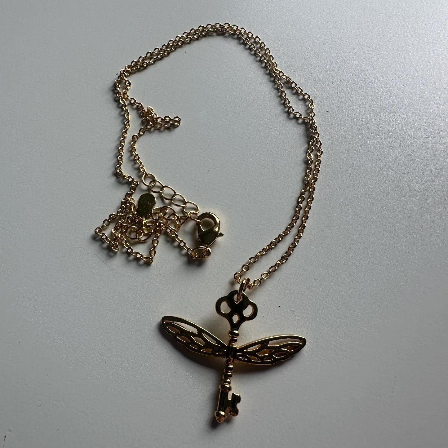 Winged/flying key necklace - gold